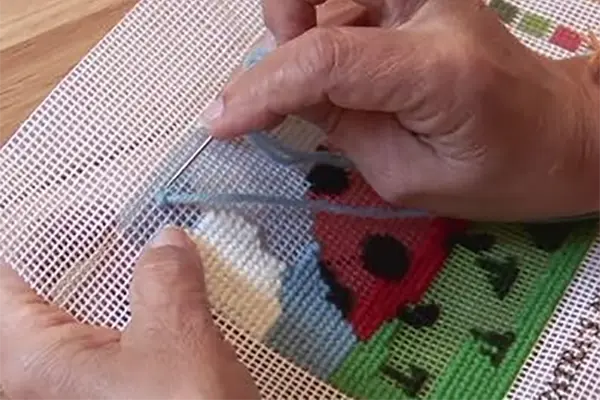 What type of yarn is used for needlepoint?